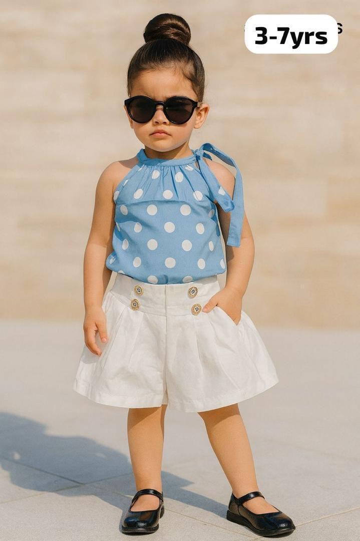 baby girl's white top and red pinafore dress combination.